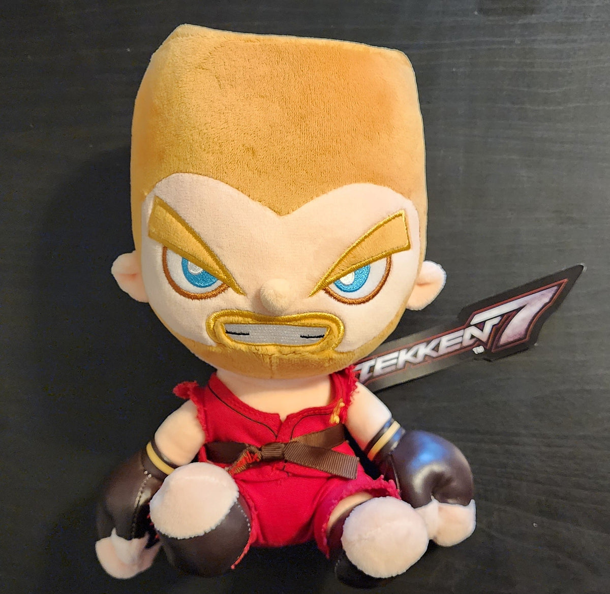 PureArts Tekken Paul Phoenix plush toy, approximately 24 cm tall, in retail packaging